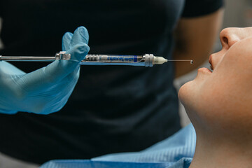Anesthesia in dentistry. Anesthetic before dental treatment. Anesthetic in a syringe in front of...