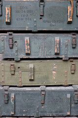 Soviet army ammunition stack of green crates with russian names of ammo type and category number - obrazy, fototapety, plakaty