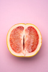 Half blood orange on pink background