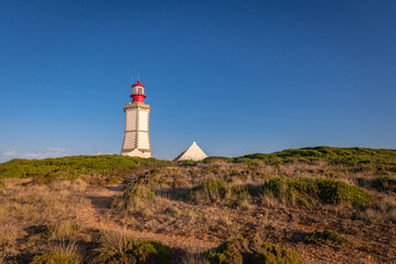 Fototapeta na wymiar Lighthouse on Cabo Espichel headland In Setubal District, Portugal
