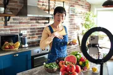 Woman Demonstrating Healthy Cooking Tips on a Live Stream