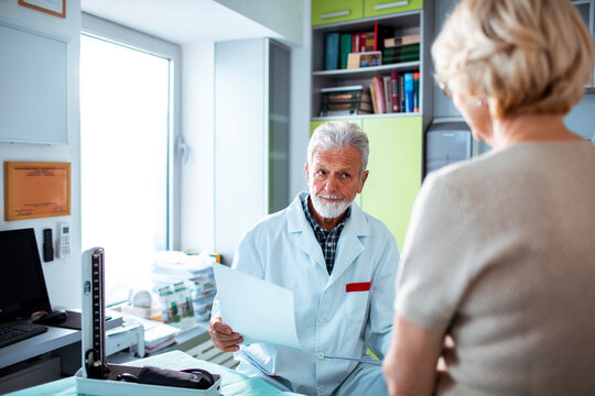 Senior Patient Discussing Health with Doctor in Clinic