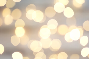 Background with abstract golden sparkling christmas lights. Bokeh effect. Defocused. Template mock...