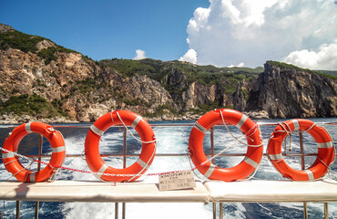 Tourist boat during trip along coast of on Corfu Island, Greece