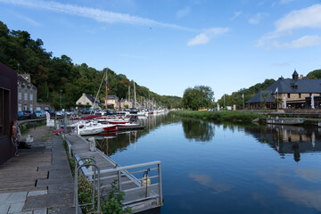 rows of moored boats and yachts on the scenic La Rance river, Dinan France