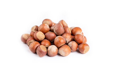 Shelled hazelnuts on the white background