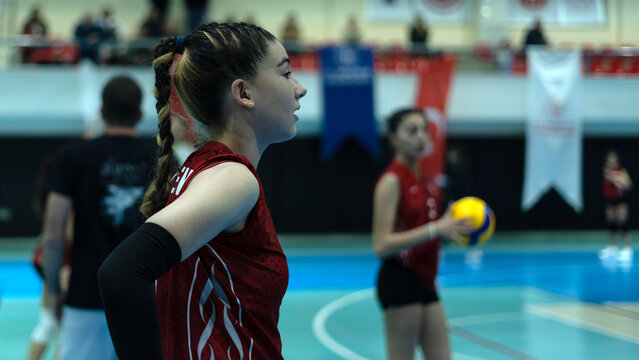 young woman volleyball player at match