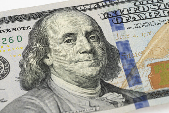 Macro photo of Benjamin Franklin on one hundred US Dollar bill. Money of United States. Business and finance concept. Selective focus.