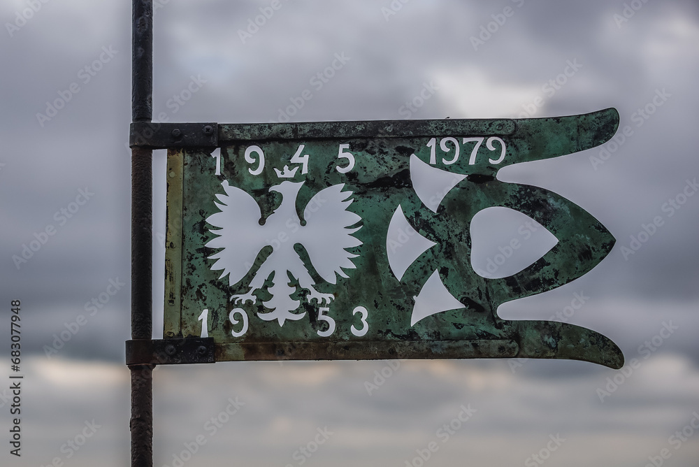 Wall mural Polish ensign on the top of the tower of Saint Mary Church on Old Town of Gdansk city, Poland