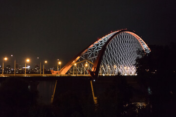 Obraz premium Bugrinsky Bridge over the River Ob, Novosibirsk, Russia.Lightened bridge in the night.