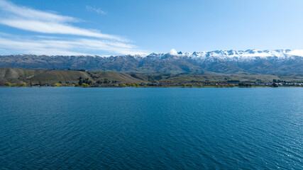 Panoramic aerial drone views of Lake Dunstan and its mountainous shoreline in central Otago