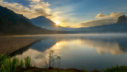 nature landscape; a beautiful sunrise over a mountain lake with