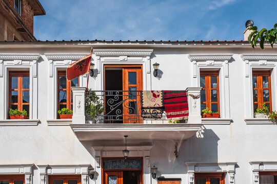 Albanian flag on the traditional house in Albania, Historical Houses in old city, street photo