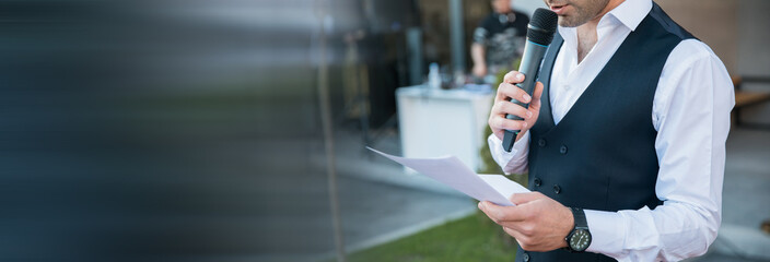 speaker hand paper and microphone