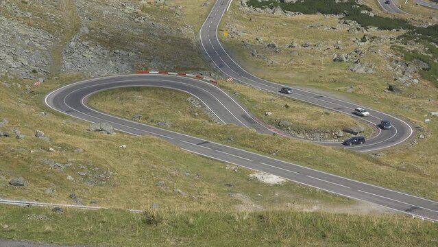 Winding road with hairpin turns in the high mountains