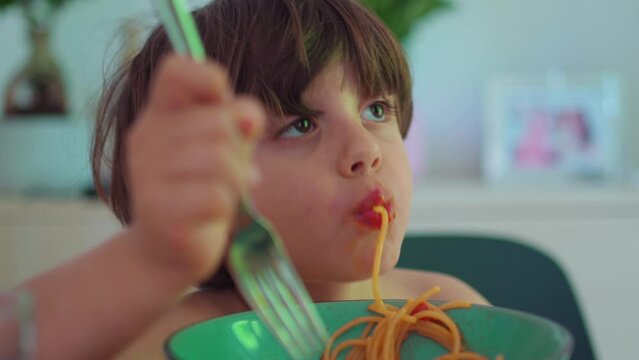 Little Boy Enjoying Spaghetti Meal Close-Up, Youngster savoring His Pasta Dish