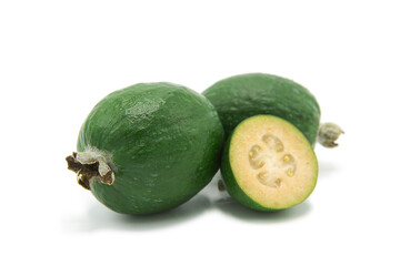 Fresh ripe feijoa whole and half isolated on white background.