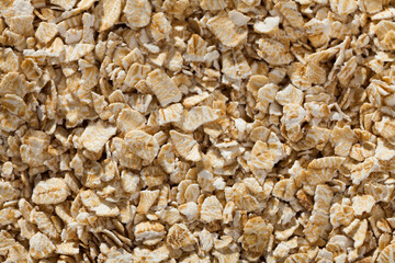 Diet food. Uncooked rolled oats as natural background..