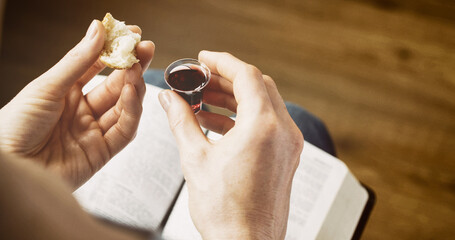Woman taking communion - bread and wine. Christian faith and practice concept - 683098347