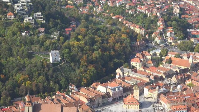 Aerial top view panorama tilt of Brasov city center and Council Square, Romania