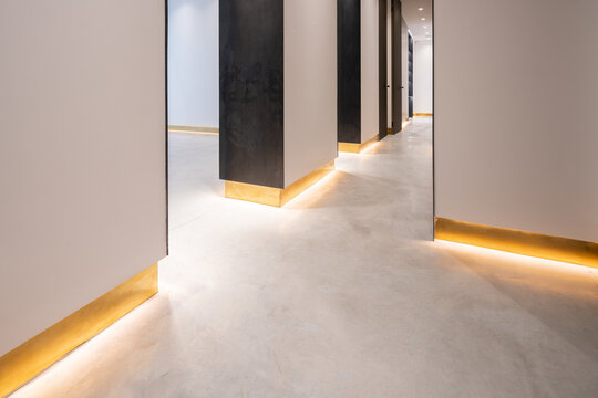 Illuminated baseboard in modern house