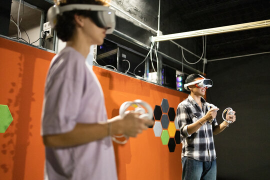Two people enjoying virtual reality gaming
