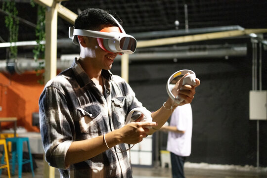 Young man enjoying virtual reality game experience