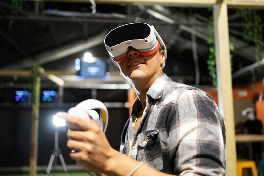 Man experiencing virtual reality in a modern setting