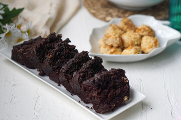 Chocolate moist cake with nuts and cornflakes cookies.