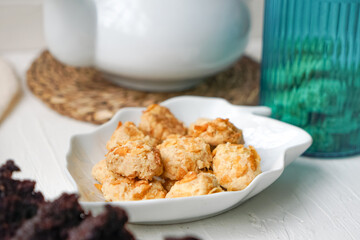 Cornflakes cookies in a white plate. Selective focus.