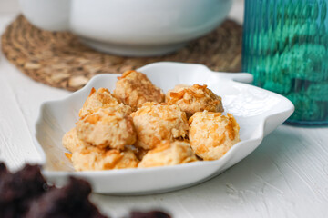 Cornflakes cookies in a white plate. Selective focus.
