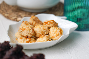 Cornflakes cookies in a white plate. Selective focus.