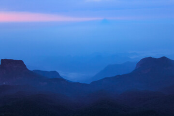 The sunrise sky and the morning mist at the Adam's Peak, Sri Lanka