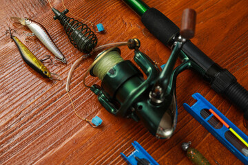 Fishing tackle on wooden table, closeup view