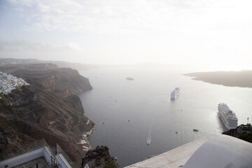 Two cruise ships anchored in Santorini, Greece - obrazy, fototapety, plakaty