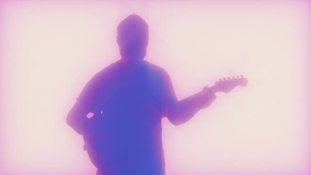 Silhouetted Musician Playing The Guitar