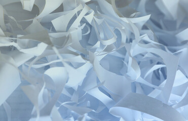 Shredded paper texture background, top view of many white paper strips. Pile of cut paper like...