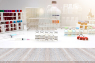 The wooden table is empty and laboratory background