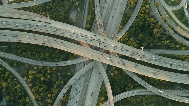 Major intersection Interstate Freeway I10 and I610 in Houston Texas, drone ascend