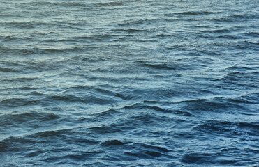 The raging waters of the river. Top view background texture of the raging elements. White foam on...
