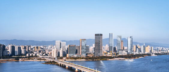 Fototapeta na wymiar CBD city skyline scenery along the Min River in Fuzhou, Fujian, China