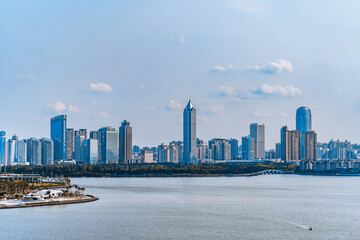 Obraz premium Coastline and yachts of CBD buildings in Haikou, Hainan, China