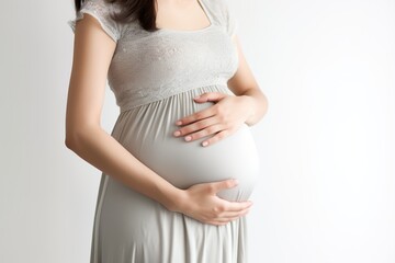 Close up, Pregnant woman stroking her belly, isolated on a white background