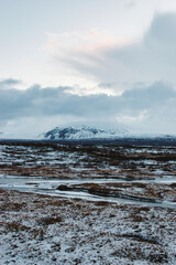 View of the snowy plateau in winter at Thingvellir National Park in Iceland. November 2021 during the Covid 19 Pandemic. On a cold winter morning.