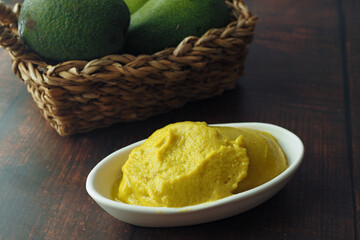 avocado and avocado pasted in a container