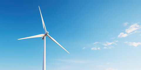 Fototapeta premium Solitary wind turbine stands tall against the backdrop of a clear sky