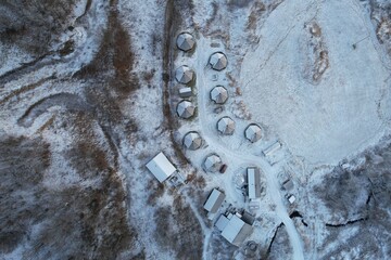 Frost blankets a unique geodesic dome campsite in the heart of a serene Norwegian landscape