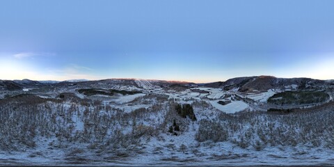 Dusk falls softly over the tranquil waters of a Norwegian fjord