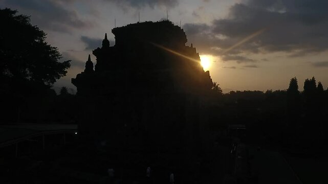 Silhouette Aerial Footage of Crowded Ancient Historical Mendut Candi Temple at Magelang, Central Java, Indonesia