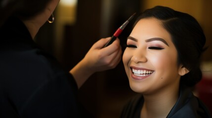 A bride having makeup done before her wedding.